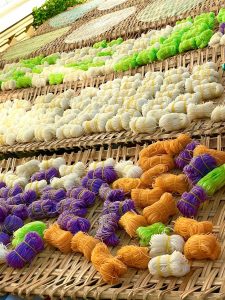 Sunrice floating market with wooden boat