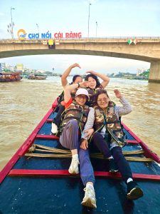 Sunrice floating market with wooden boat